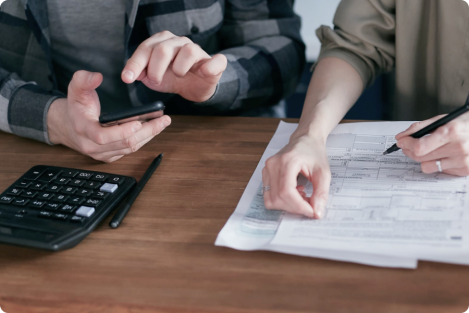 people doing their bookkeeping at a table